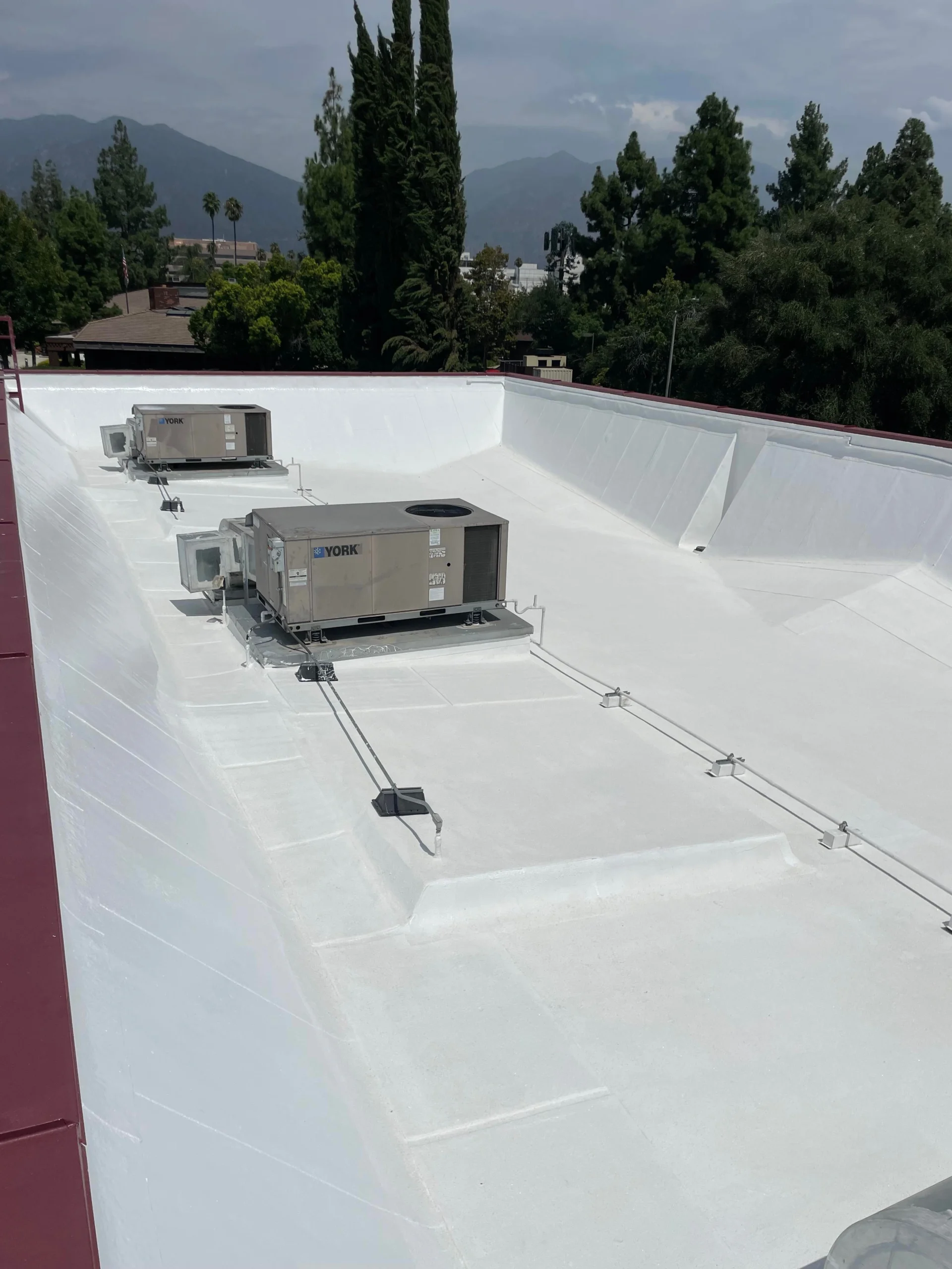 White commercial roof with HVAC units Southern California.