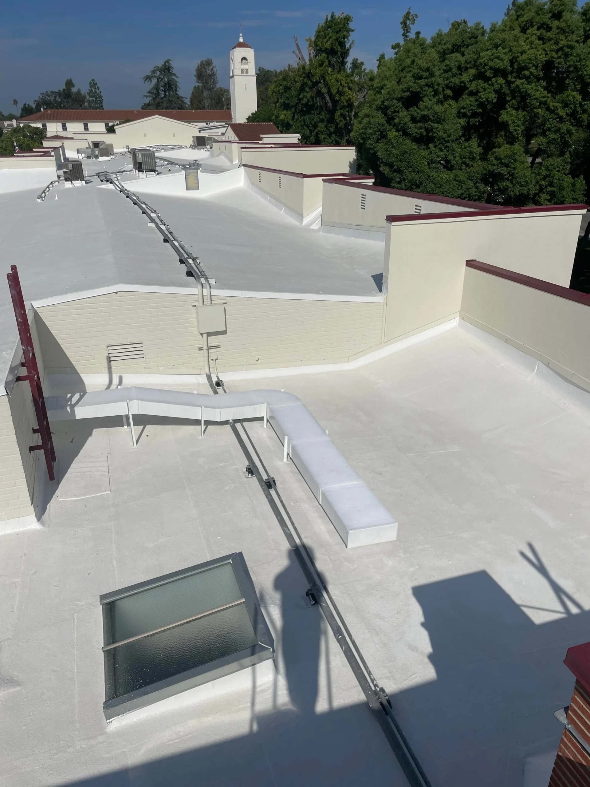 Commercial roofing project in Southern California with white coating.