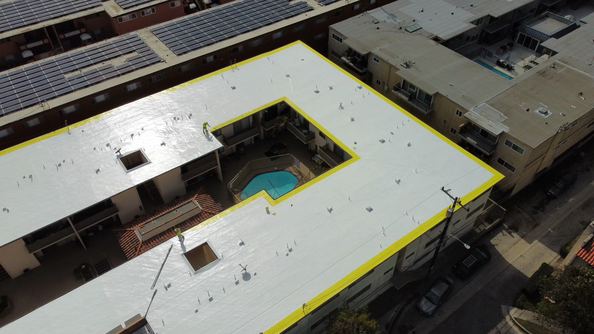 Silicone-coated commercial roof with pool in Southern California
