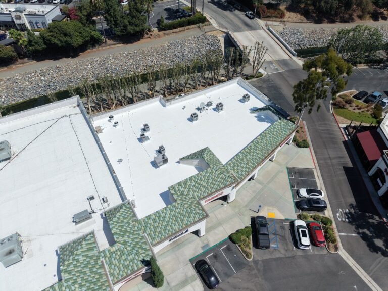 Aerial view commercial building roof Southern California parking lot