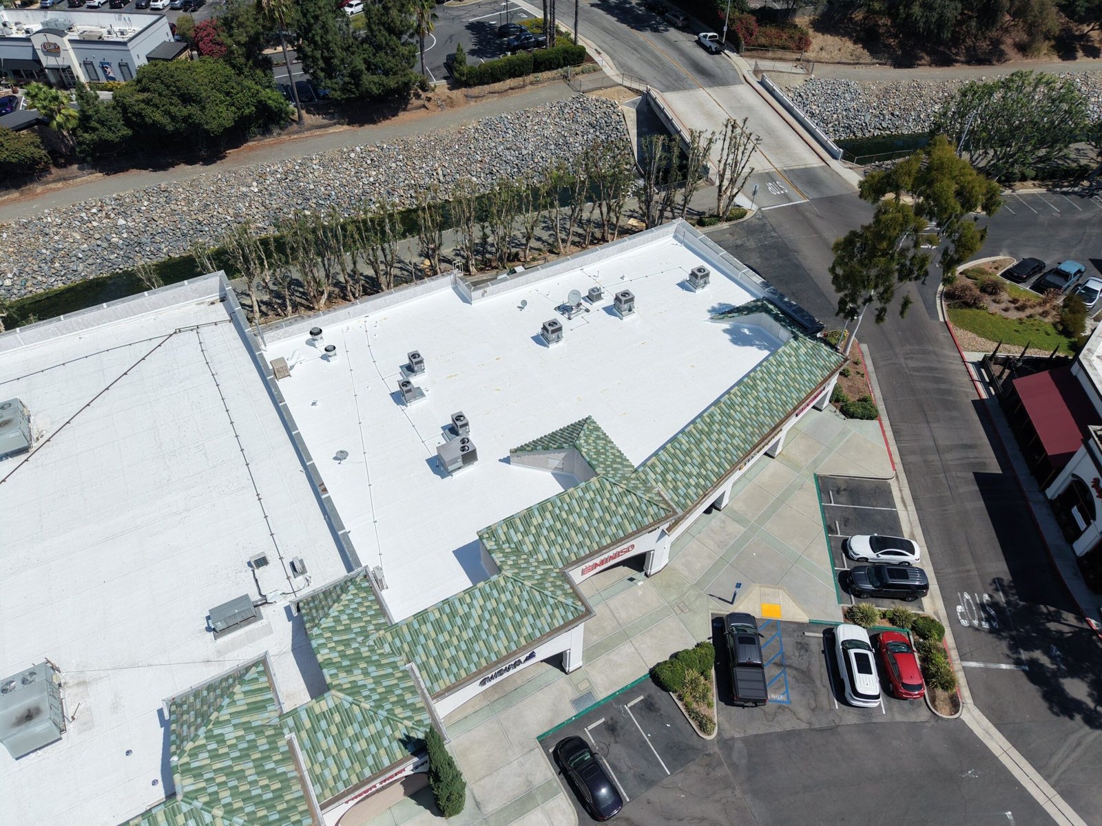 Aerial view commercial building roof Southern California parking lot