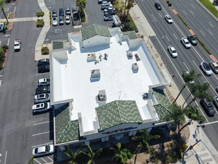 Aerial view commercial building roof Southern California parking lot